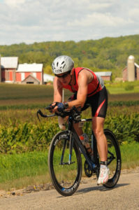 David Miles biking during the Iron Man race