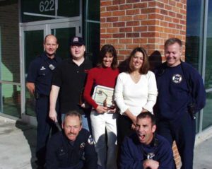 Donna (second from the right) smiling with the team that rescued her life.