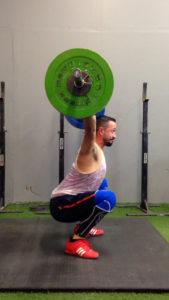 Art demonstrating the "snatch" exercise of Olympic lifting.